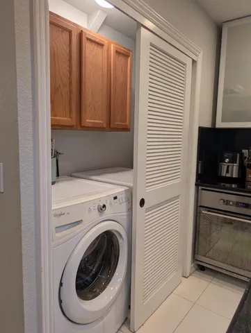 a view of a kitchen with washer and dryer