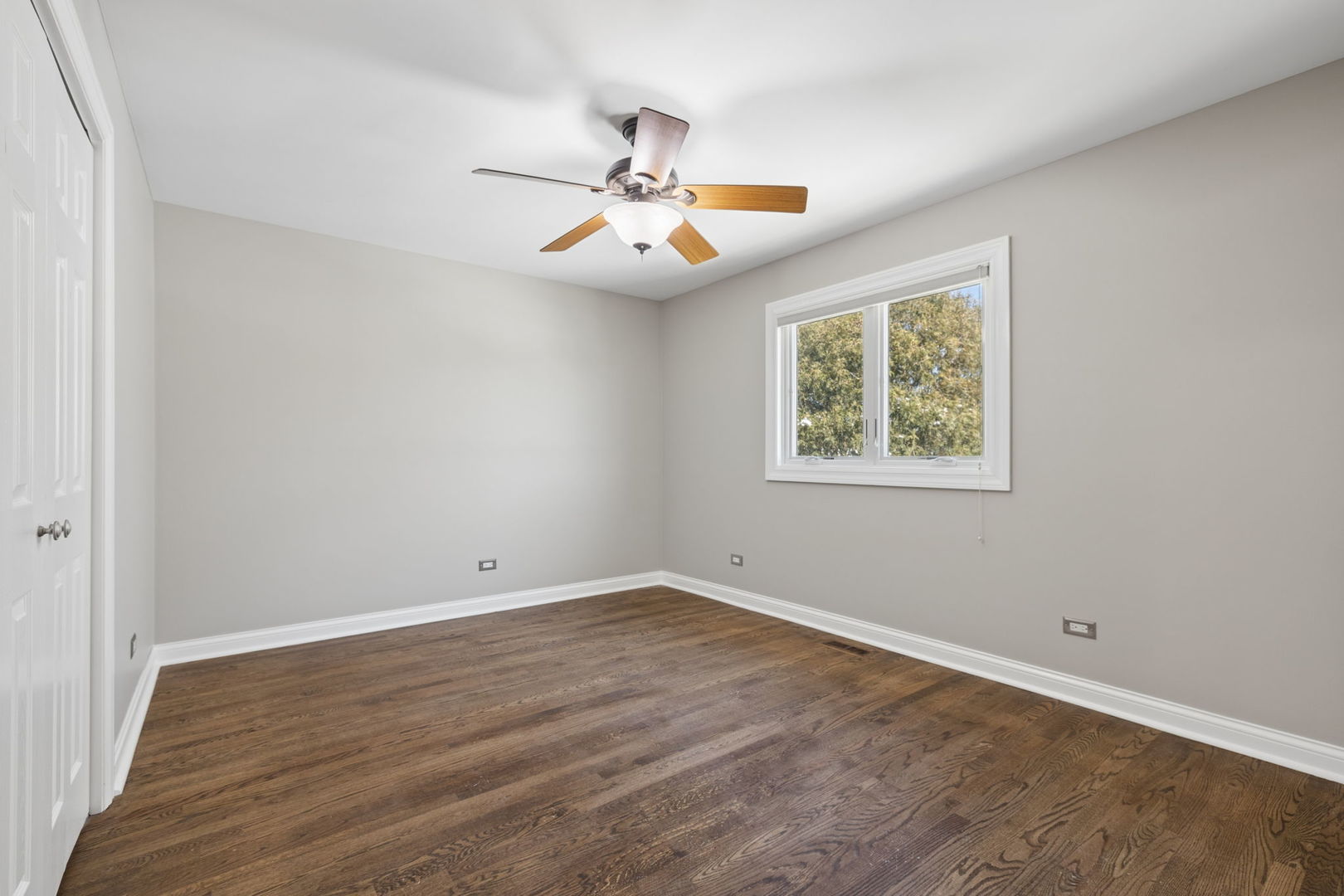 1336 Tralee Lane Lockport, IL 60441 - Photo 17 of 35 an empty room with wooden floor chandelier fan and windows