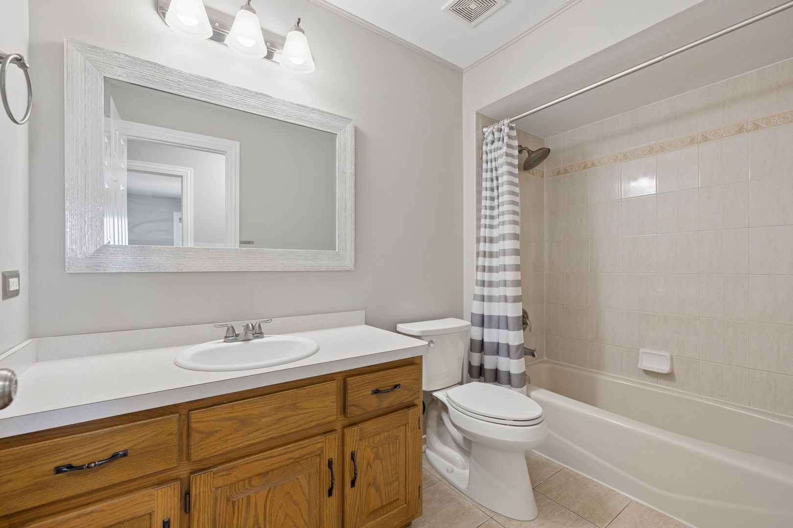 1336 Tralee Lane Lockport, IL 60441 - Photo 19 of 35 a bathroom with a sink a toilet and shower