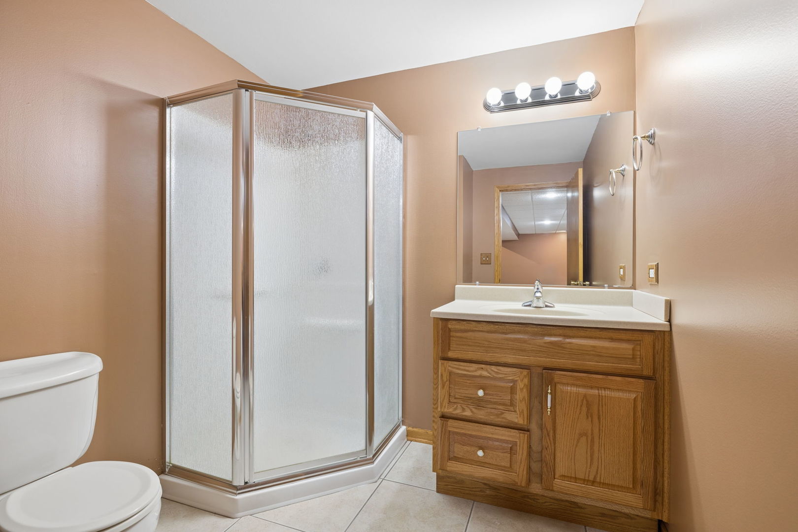 1336 Tralee Lane Lockport, IL 60441 - Photo 24 of 35 a bathroom with a granite countertop sink toilet and shower
