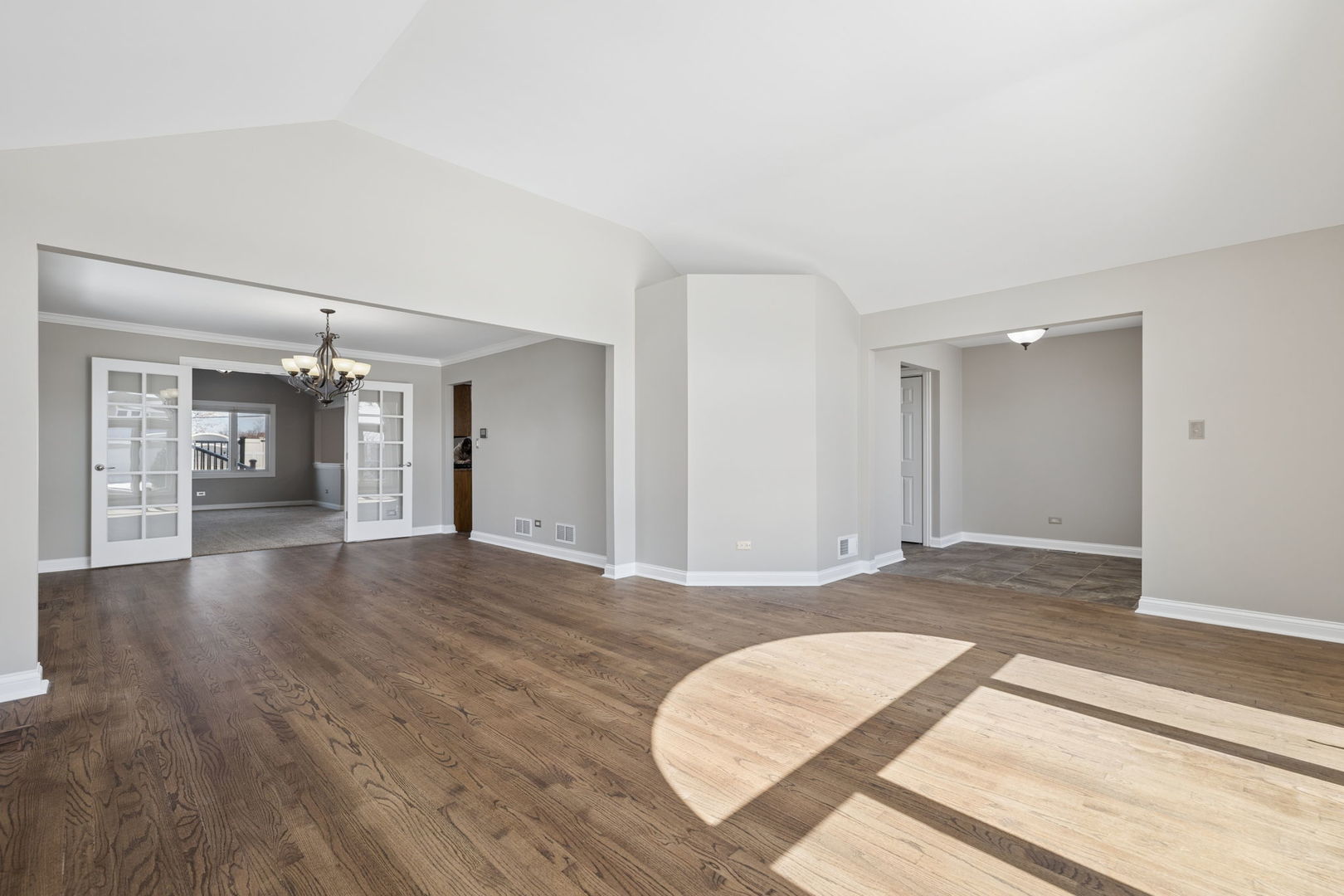 1336 Tralee Lane Lockport, IL 60441 - Photo 3 of 35 a view of an empty room and window and wooden floor