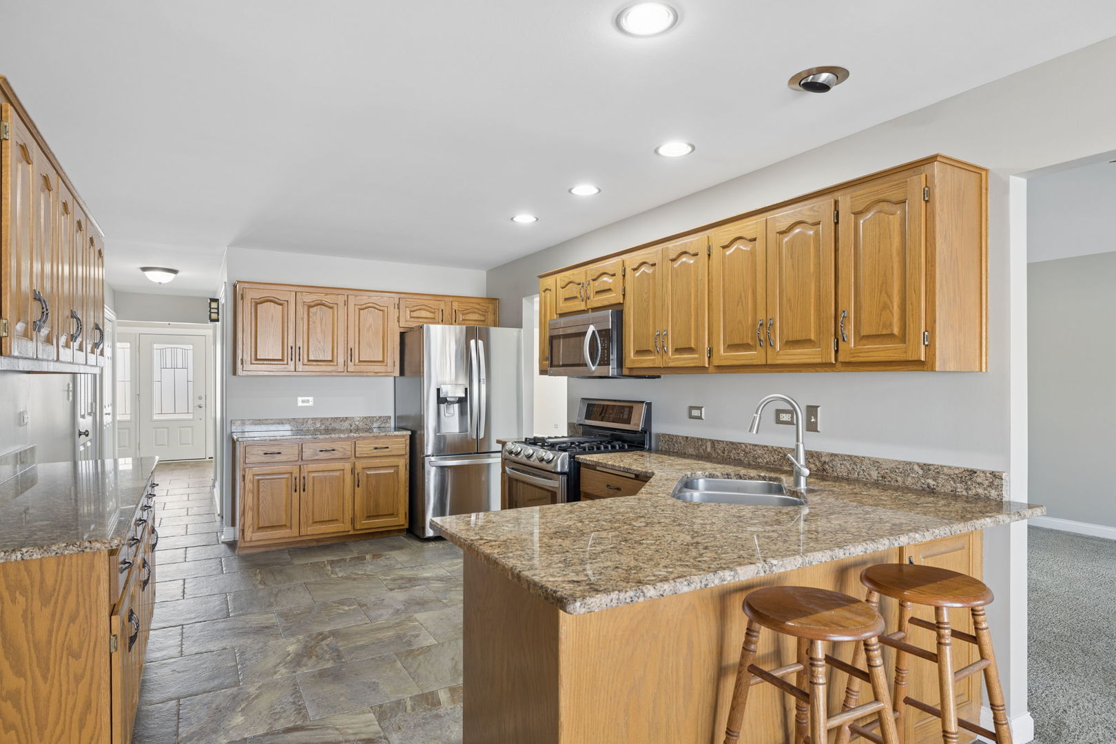 1336 Tralee Lane Lockport, IL 60441 - Photo 7 of 35 a kitchen with a sink stove and refrigerator