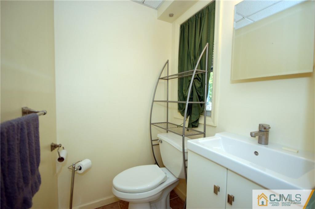 19 Ramsey Road Middlesex, NJ 08846 - Photo 14 of 17 a bathroom with a toilet sink and shower