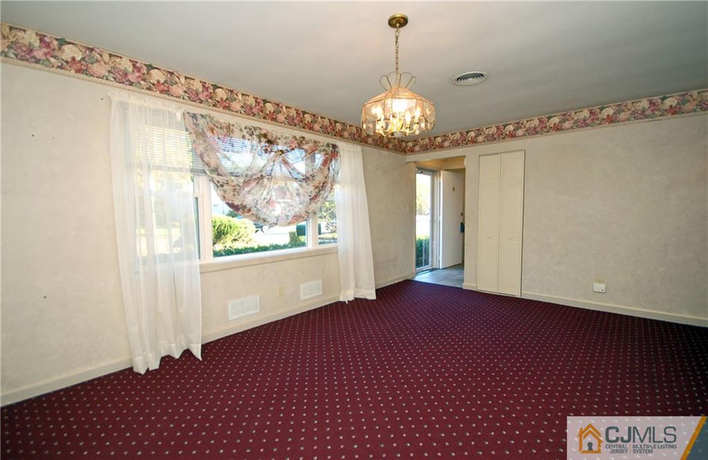 19 Ramsey Road Middlesex, NJ 08846 - Photo 3 of 17 a view of an empty room with a window