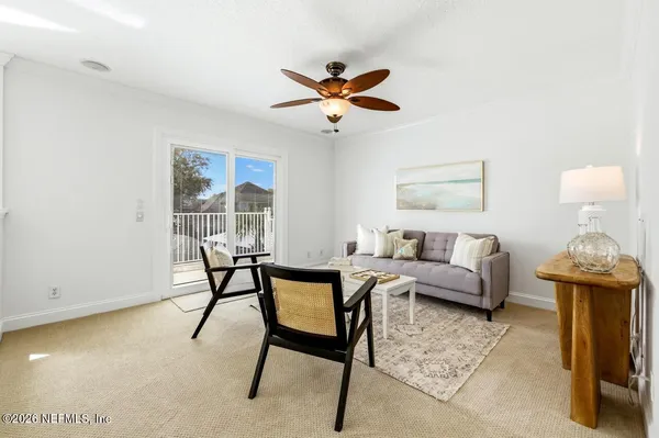 a view of a swimming pool with furniture