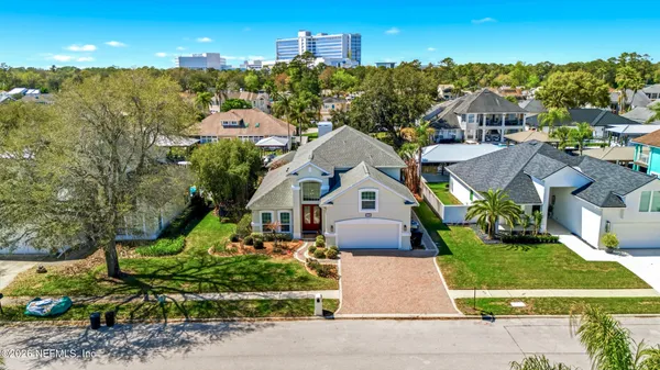 an aerial view of residential houses with outdoor space