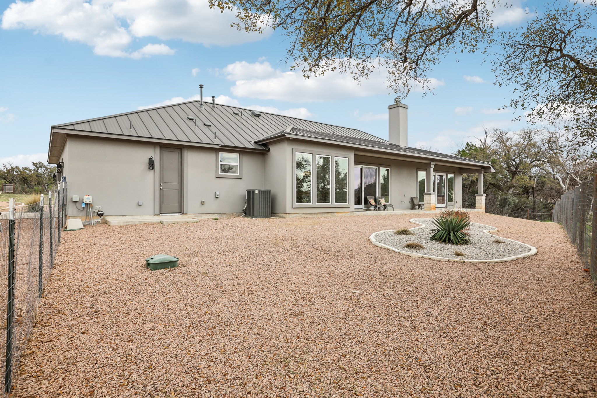 23601 Old Ferry Road, Unit 22 Spicewood, TX 78669 - Photo 29 of 38 Xeriscaping around the home allows for low maintenance and reduced water usage
