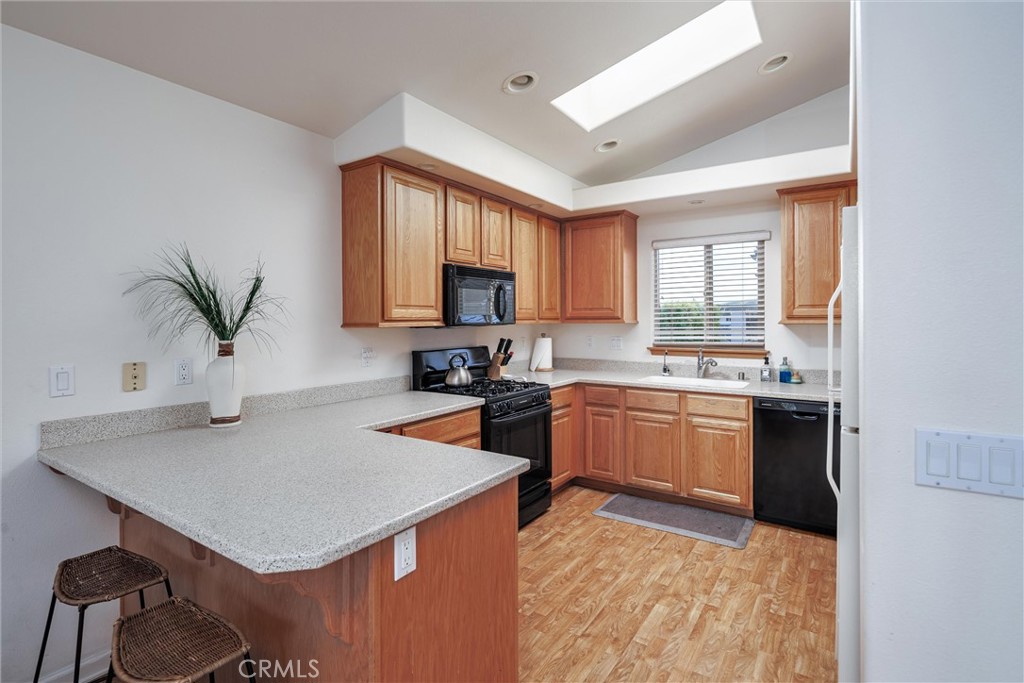 33 23rd Street Cayucos, CA 93430 - Photo 15 of 31 a kitchen with a refrigerator a stove a sink and a oven