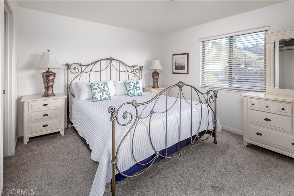 33 23rd Street Cayucos, CA 93430 - Photo 18 of 31 a bedroom with furniture a bed and a window
