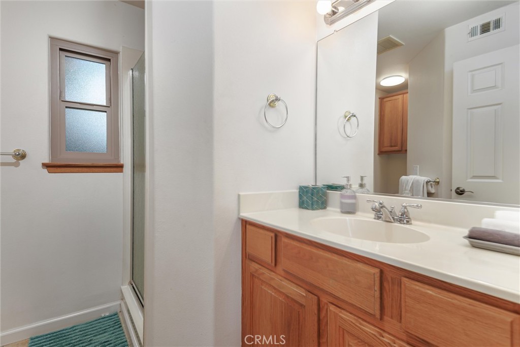 33 23rd Street Cayucos, CA 93430 - Photo 20 of 31 a bathroom with a sink and a mirror