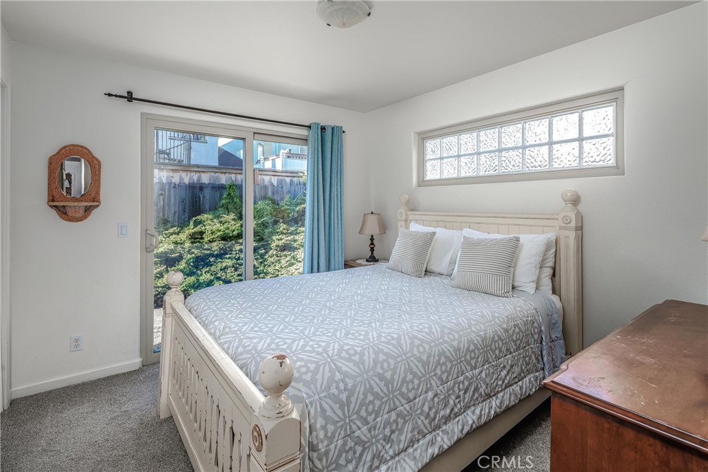 33 23rd Street Cayucos, CA 93430 - Photo 21 of 31 a bedroom with a bed and a window