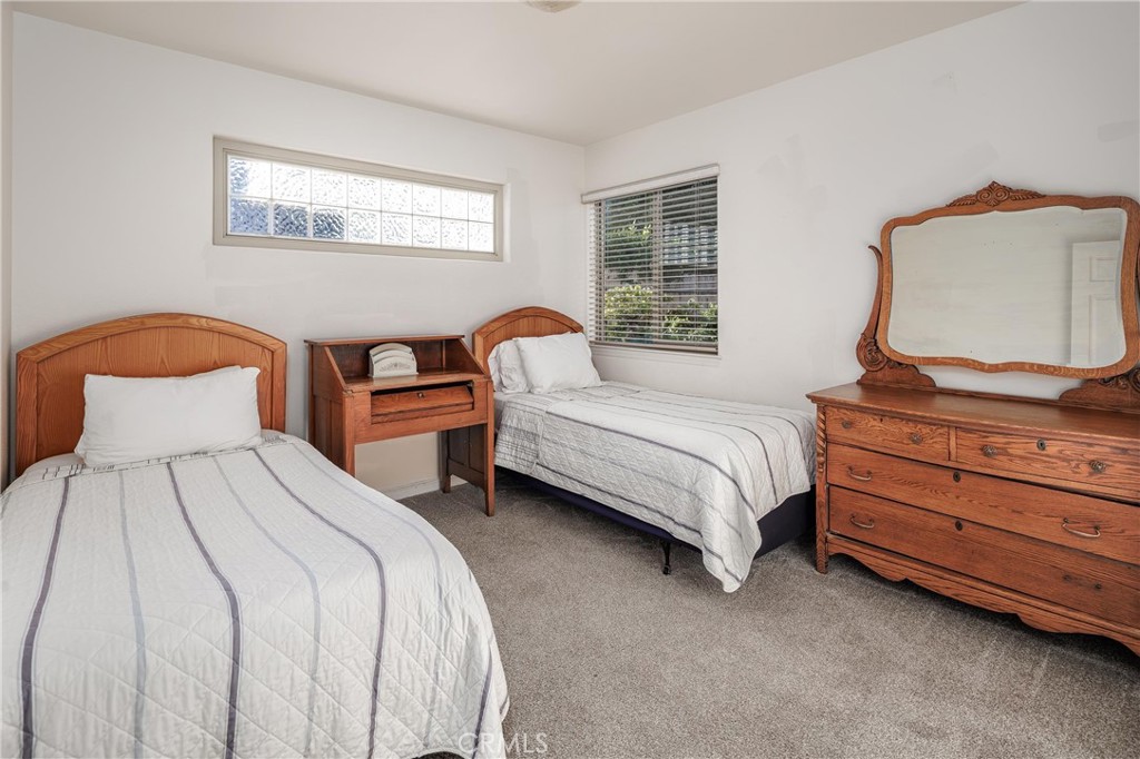 33 23rd Street Cayucos, CA 93430 - Photo 22 of 31 a bedroom with two beds and a window