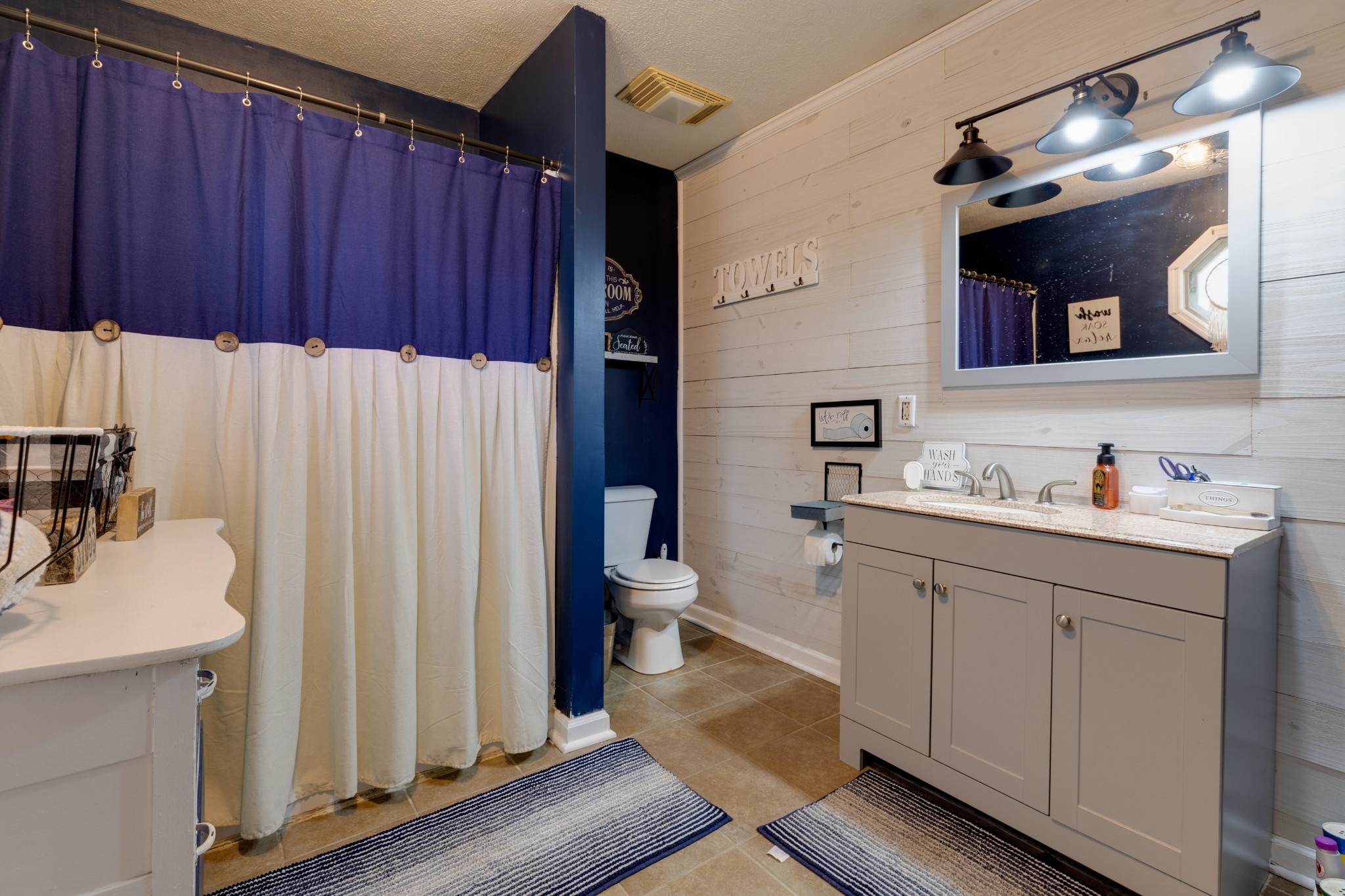 130 Mae Circle Dickson, TN 37055 - Photo 15 of 27 a bathroom with a sink and a mirror