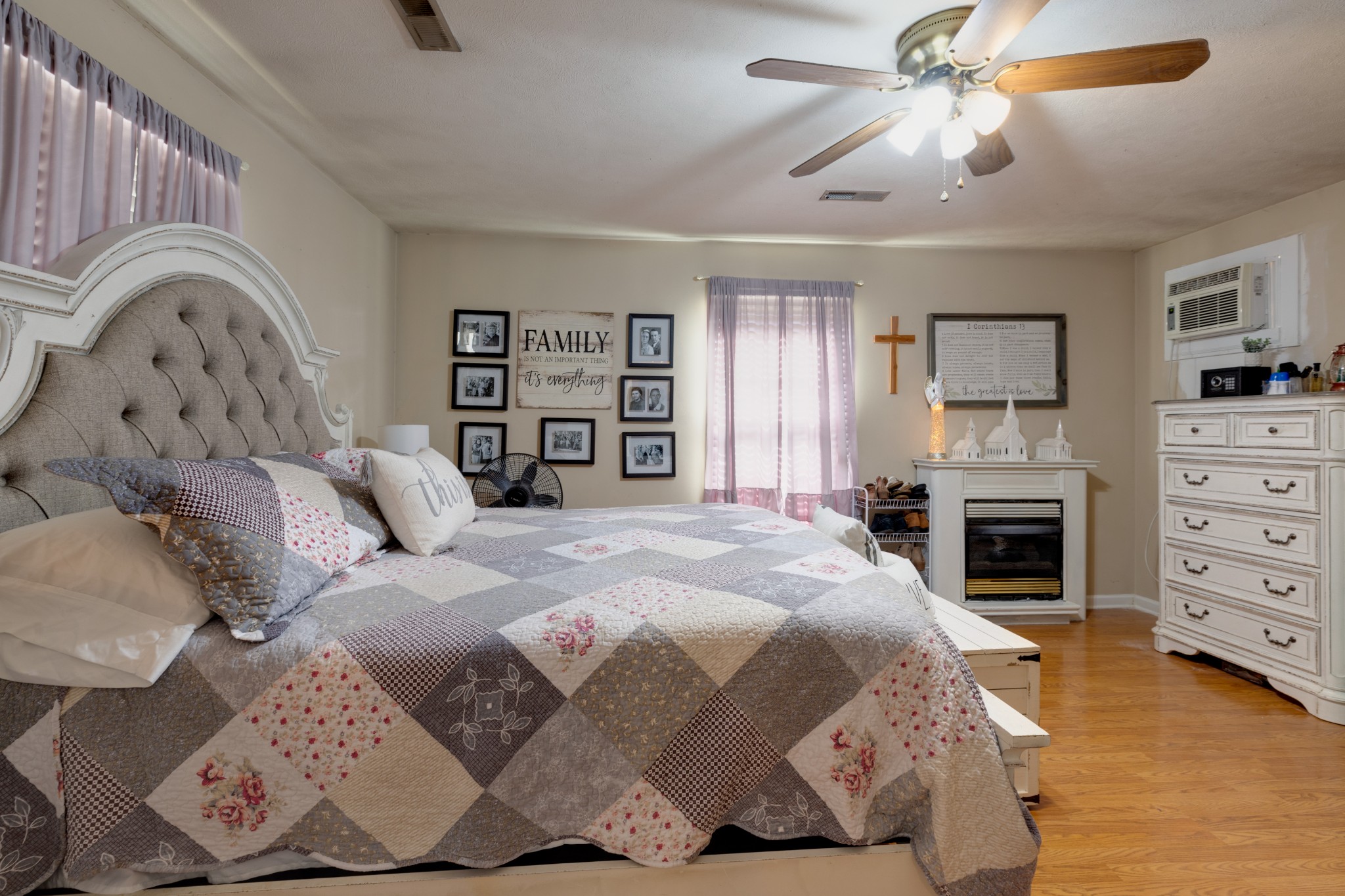 130 Mae Circle Dickson, TN 37055 - Photo 16 of 27 a bedroom with a bed and a fireplace