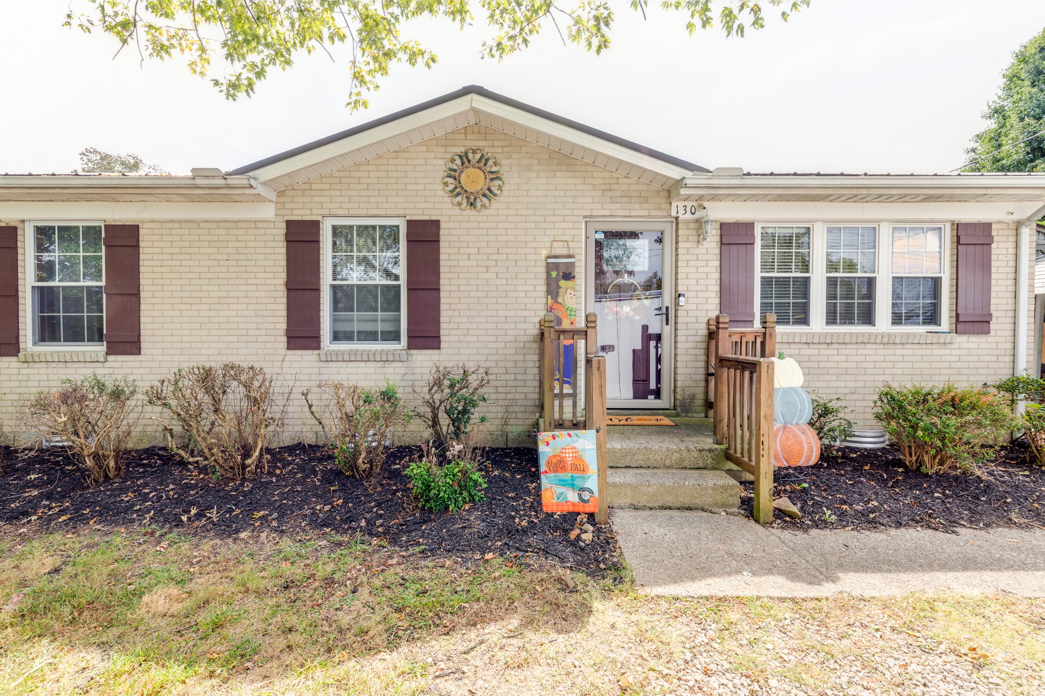 130 Mae Circle Dickson, TN 37055 - Photo 2 of 27 a front view of a house with garden