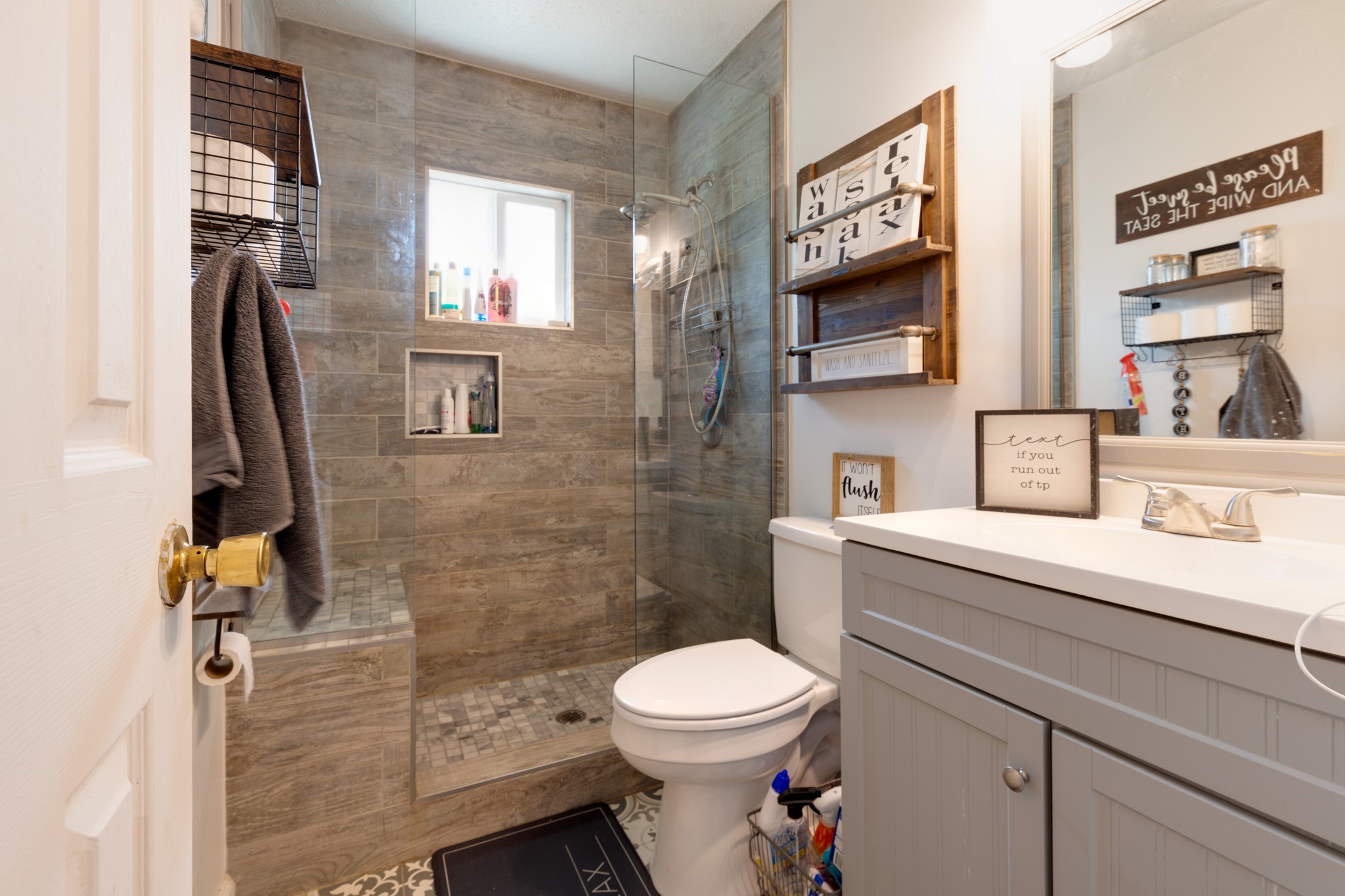 130 Mae Circle Dickson, TN 37055 - Photo 22 of 27 a bathroom with a sink a toilet and a shower