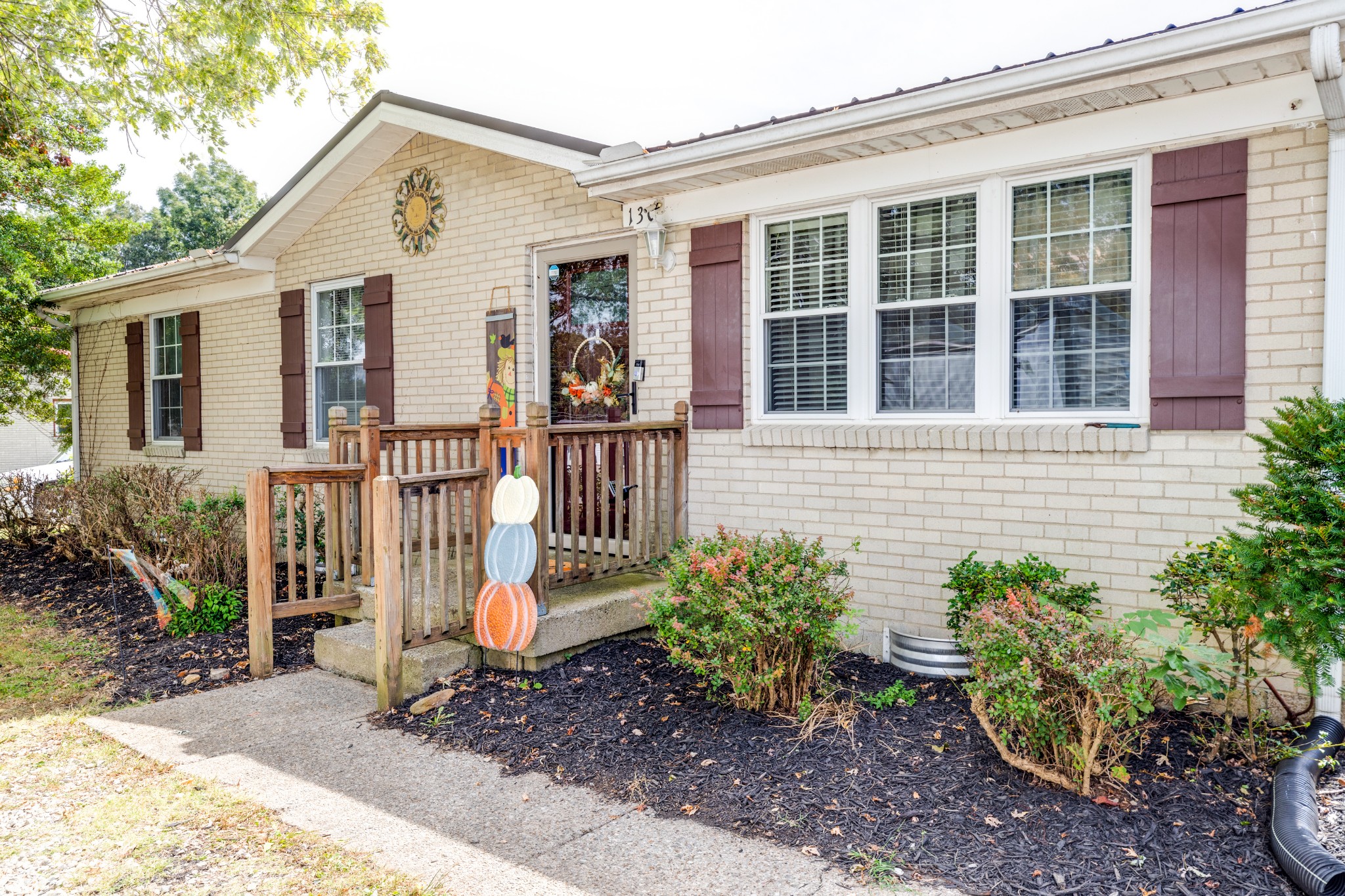 130 Mae Circle Dickson, TN 37055 - Photo 4 of 27 a front view of a house with a garden