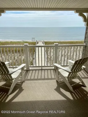 a view of a balcony with ocean view