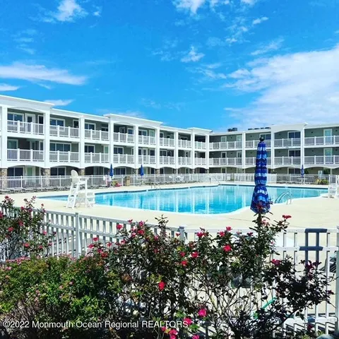 a view of a swimming pool with a garden