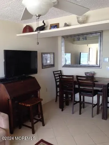 a room with furniture and a flat screen tv