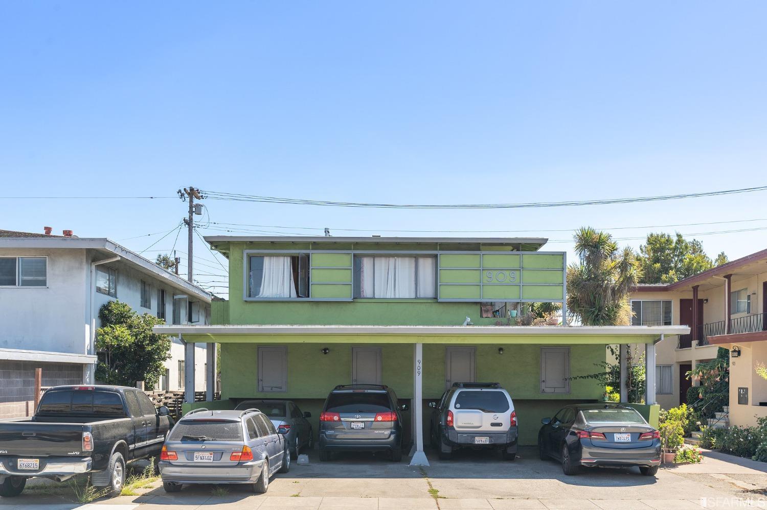 909 Rollins Road Burlingame, CA 94010 - Photo 3 of 8 a front view of a building with cars parked