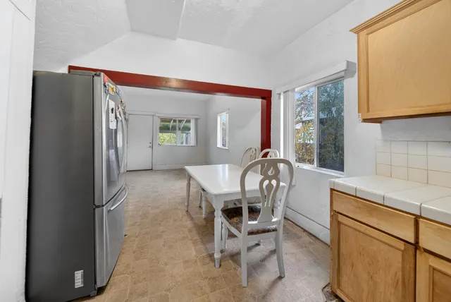 a dining room with furniture and window