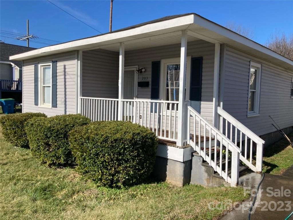 a view of a house with wooden deck