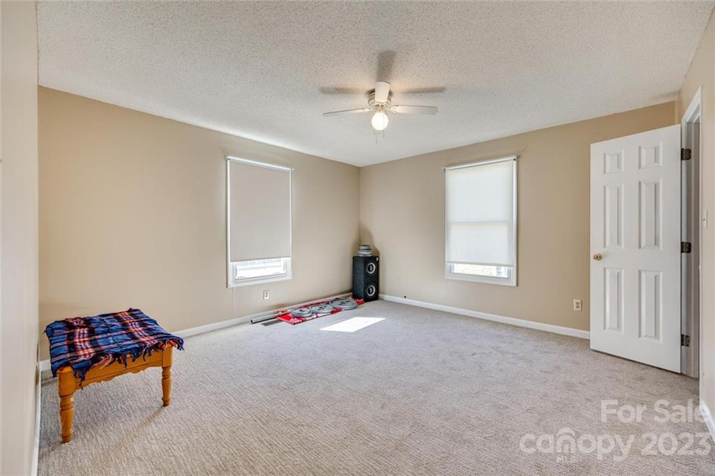 203 Brook Street Belmont, NC 28012 - Photo 11 of 17 a view of an empty room with a window