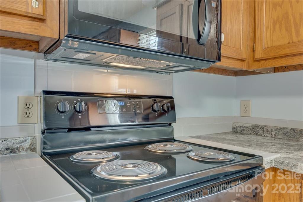 203 Brook Street Belmont, NC 28012 - Photo 14 of 17 a kitchen with a stove and a microwave