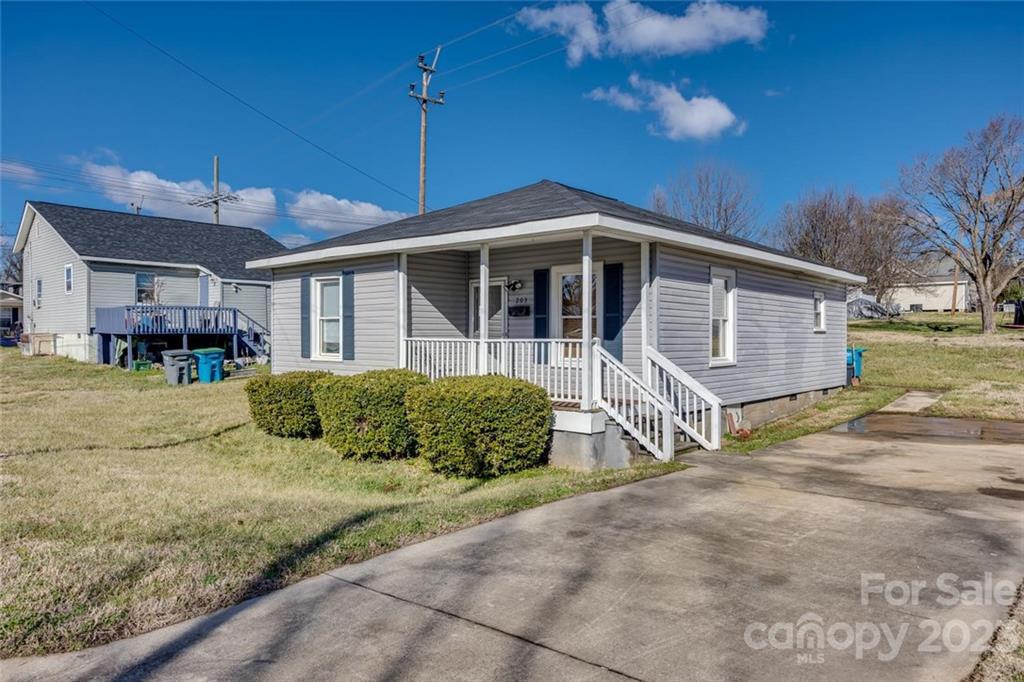 203 Brook Street Belmont, NC 28012 - Photo 3 of 17 a front view of a house with a yard