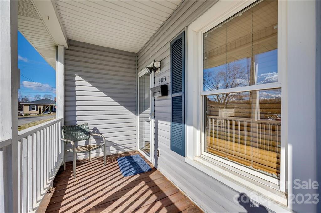 203 Brook Street Belmont, NC 28012 - Photo 4 of 17 a view of a balcony with wooden floor and a large window