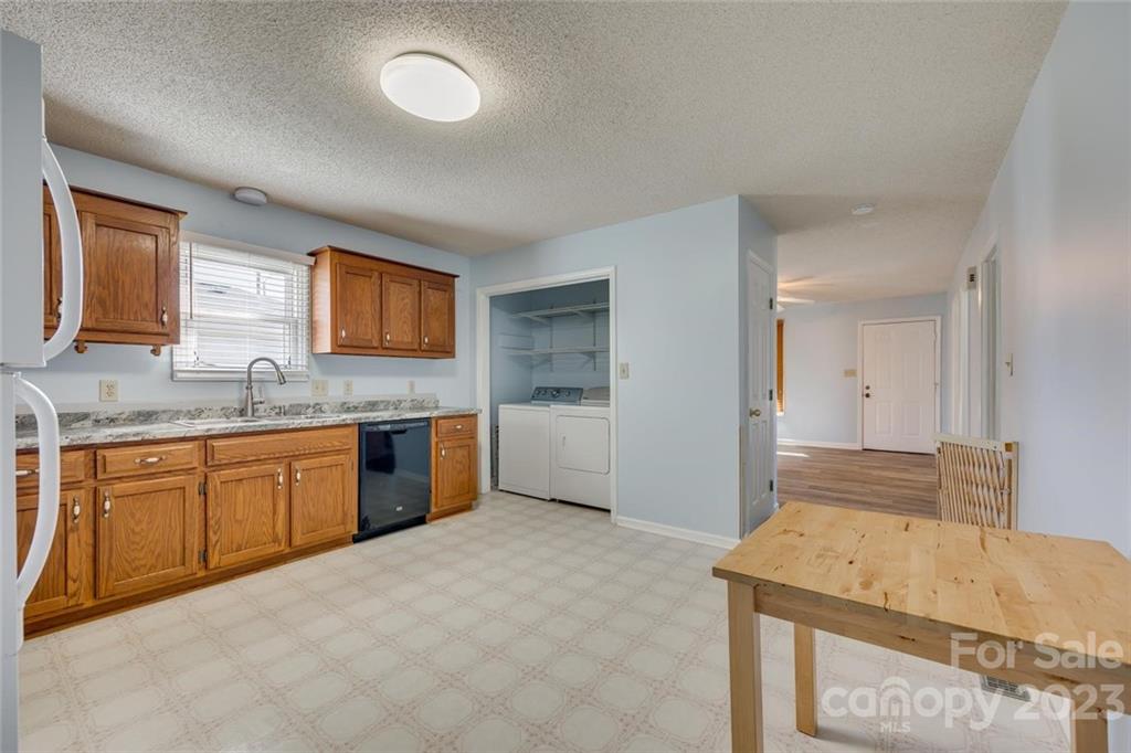 203 Brook Street Belmont, NC 28012 - Photo 9 of 17 a spacious bathroom with a granite countertop double vanity sink a mirror and a bathtub
