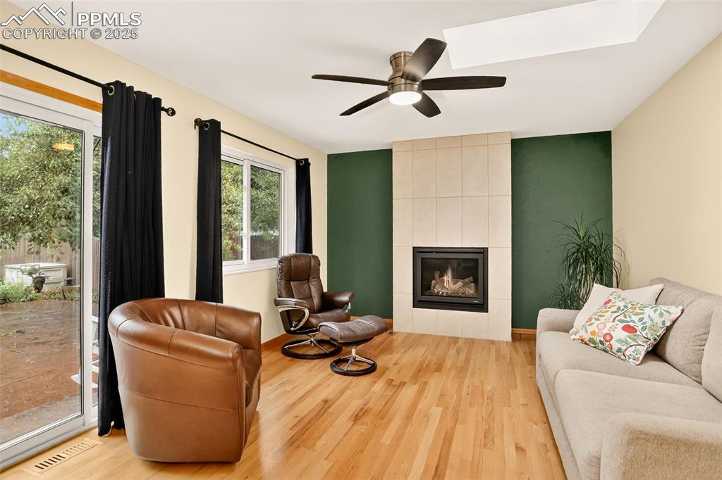 6035 Tuckerman Lane Colorado Springs, CO 80918 - Photo 19 of 47 a living room with furniture and a fireplace