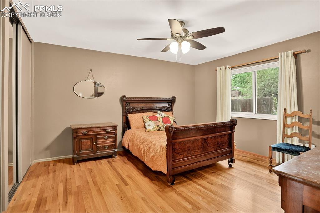6035 Tuckerman Lane Colorado Springs, CO 80918 - Photo 21 of 47 a bedroom with a bed and window