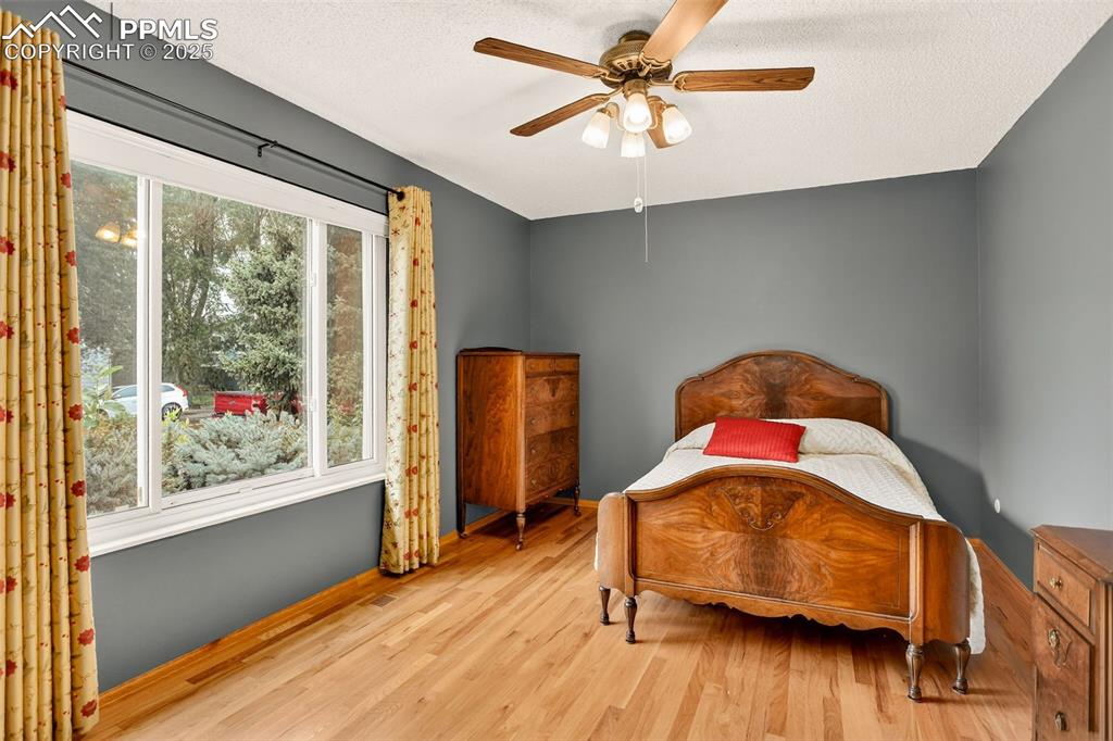 6035 Tuckerman Lane Colorado Springs, CO 80918 - Photo 28 of 47 a living room with furniture and a large window