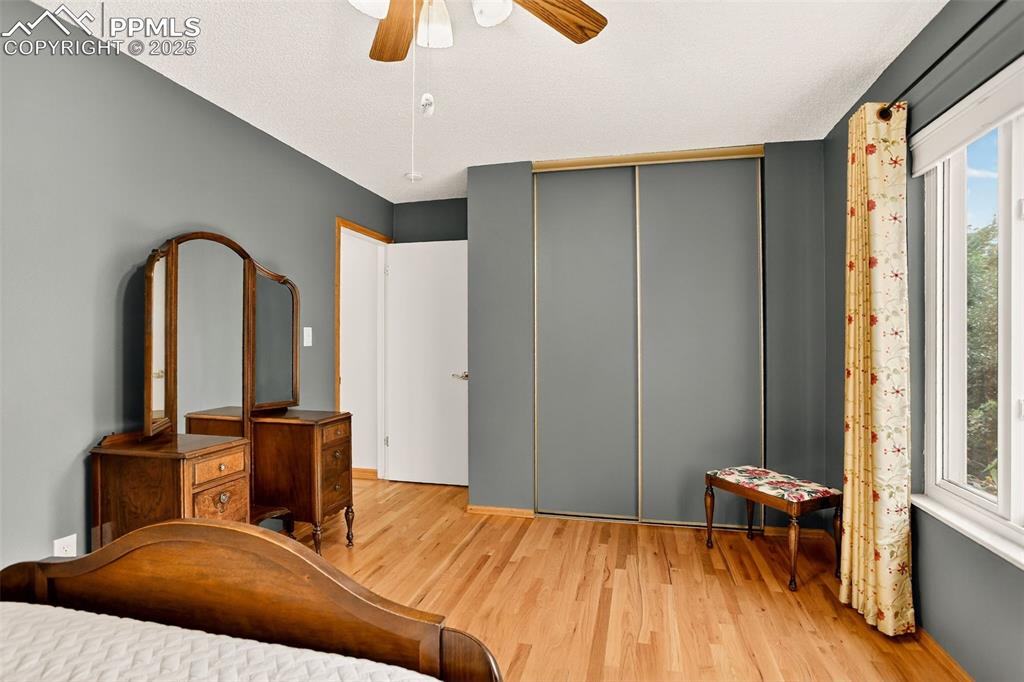 6035 Tuckerman Lane Colorado Springs, CO 80918 - Photo 29 of 47 a bedroom with a bed and a table