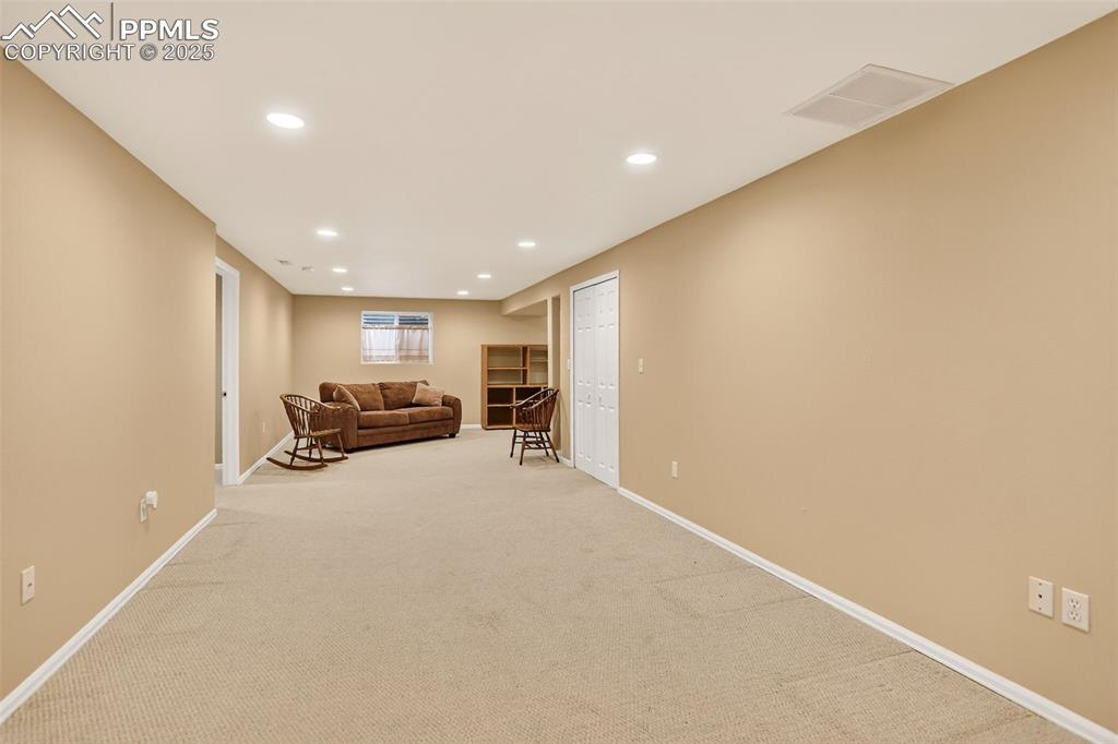 6035 Tuckerman Lane Colorado Springs, CO 80918 - Photo 31 of 47 a view of a livingroom with furniture and a ceiling fan
