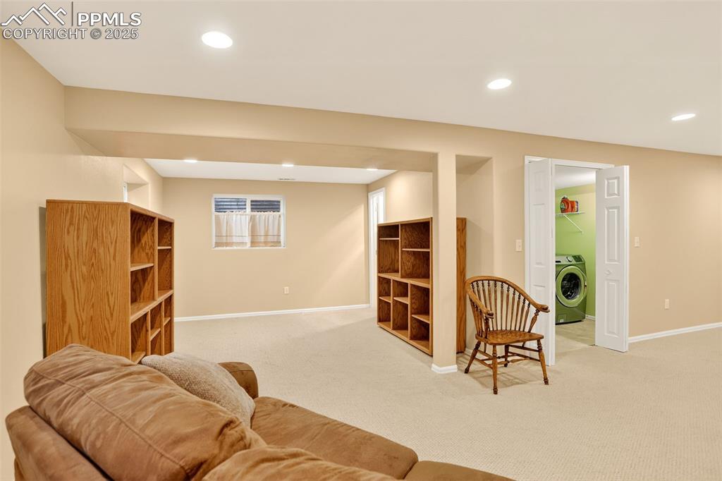 6035 Tuckerman Lane Colorado Springs, CO 80918 - Photo 33 of 47 a view of a livingroom with furniture and staircase