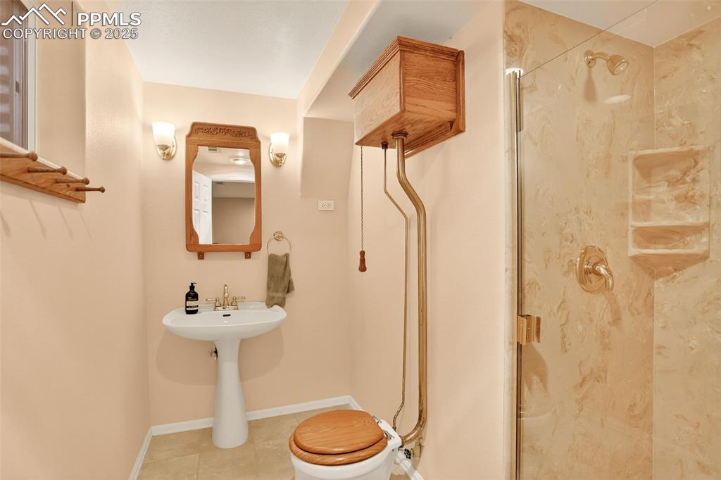 6035 Tuckerman Lane Colorado Springs, CO 80918 - Photo 36 of 47 a bathroom with a sink toilet and shower