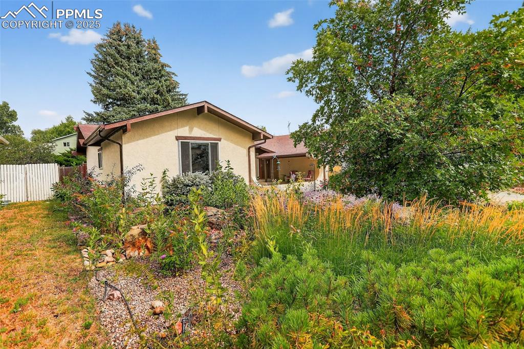 6035 Tuckerman Lane Colorado Springs, CO 80918 - Photo 5 of 47 a house view with a outdoor space