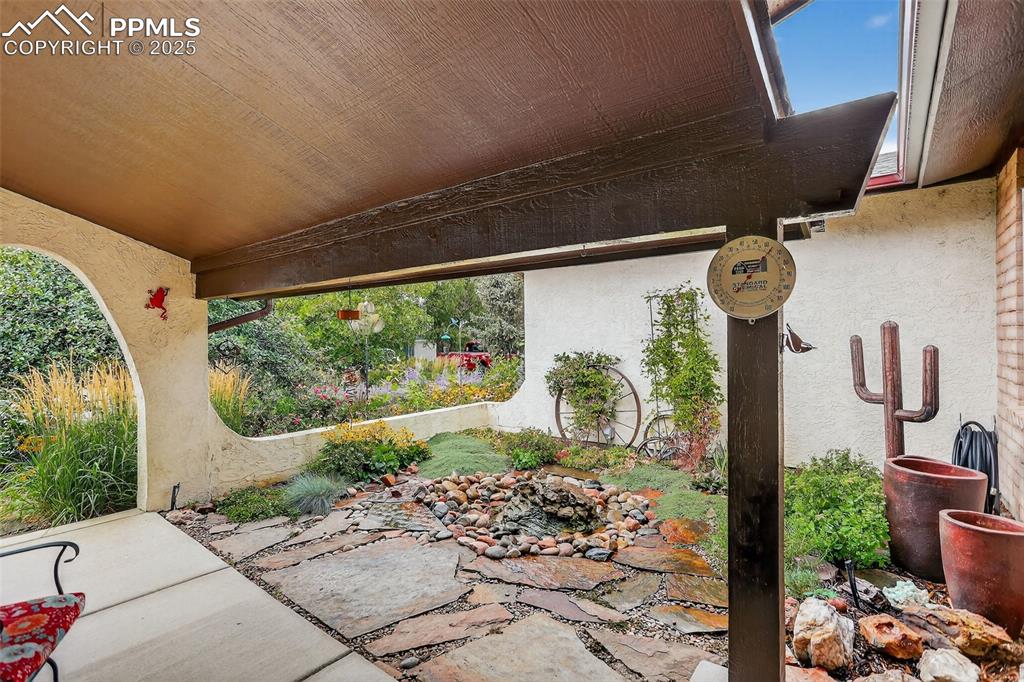 6035 Tuckerman Lane Colorado Springs, CO 80918 - Photo 9 of 47 a front view of a house with garden
