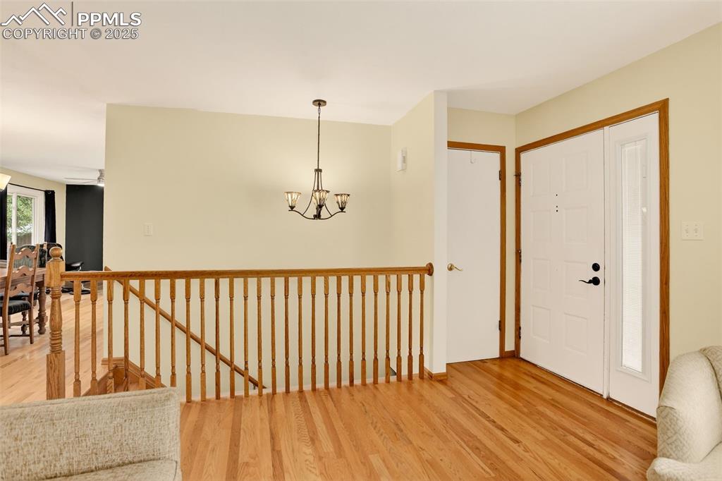 6035 Tuckerman Lane Colorado Springs, CO 80918 - Photo 10 of 47 a view of hallway with wooden floor