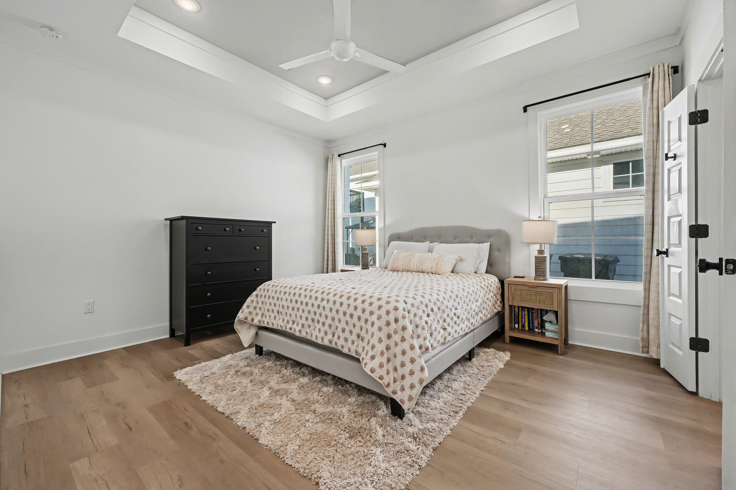 141 South H Street Pensacola, FL 32502 - Photo 12 of 30 a bedroom with a large bed and wooden floor