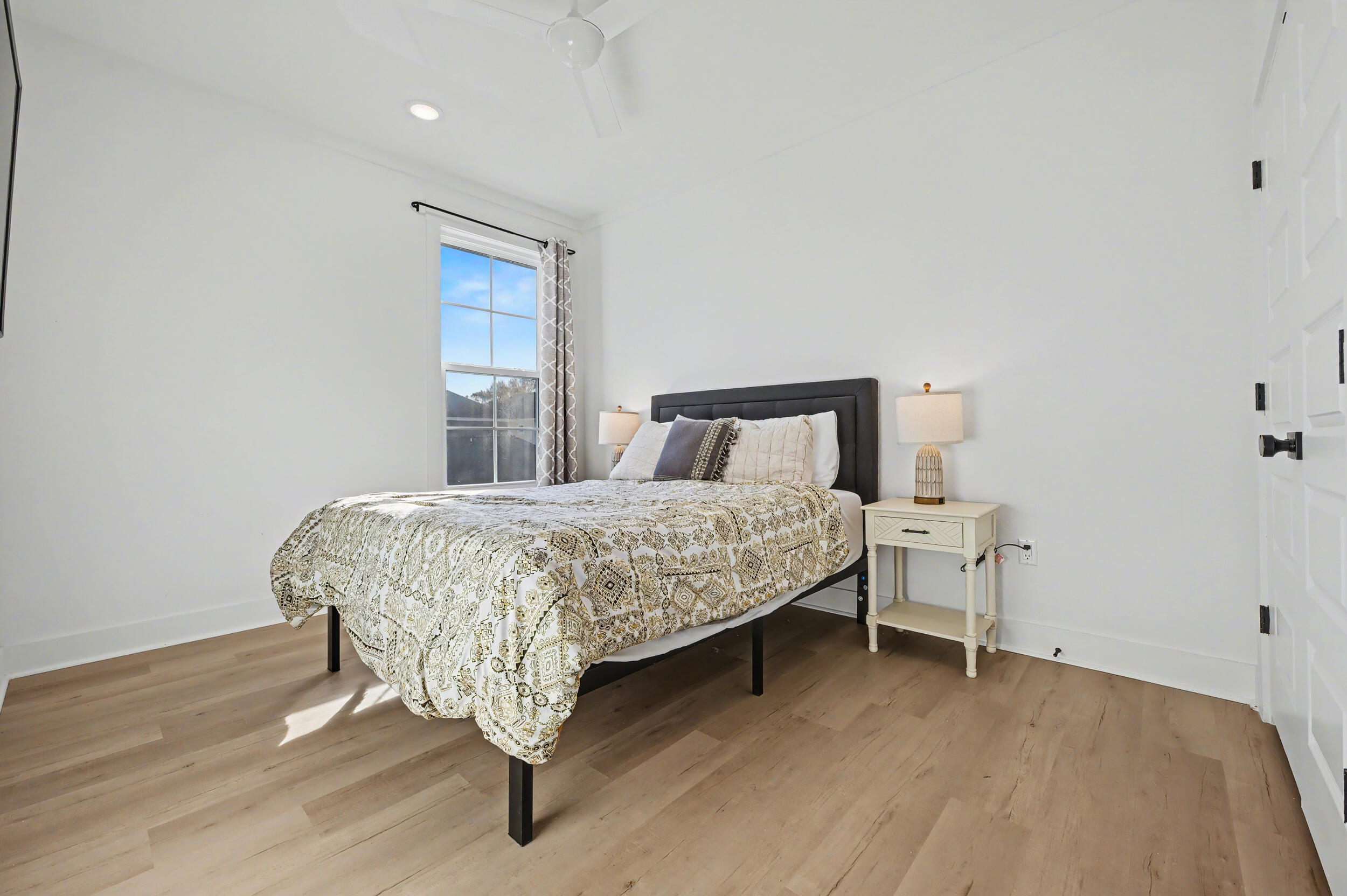 141 South H Street Pensacola, FL 32502 - Photo 17 of 30 a bedroom with a bed and window