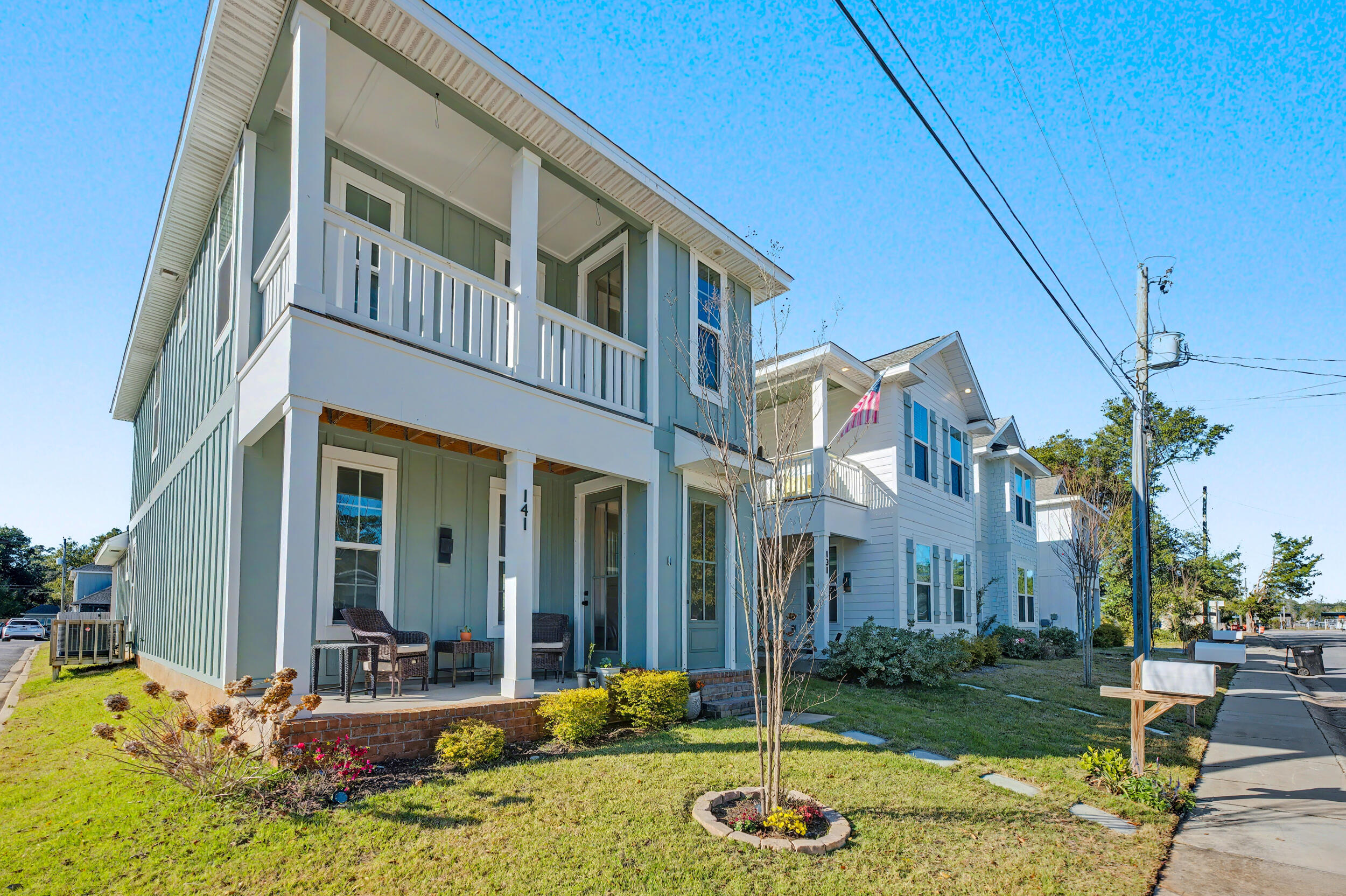 141 South H Street Pensacola, FL 32502 - Photo 2 of 30 a view of a brick house with many windows plants and big yard