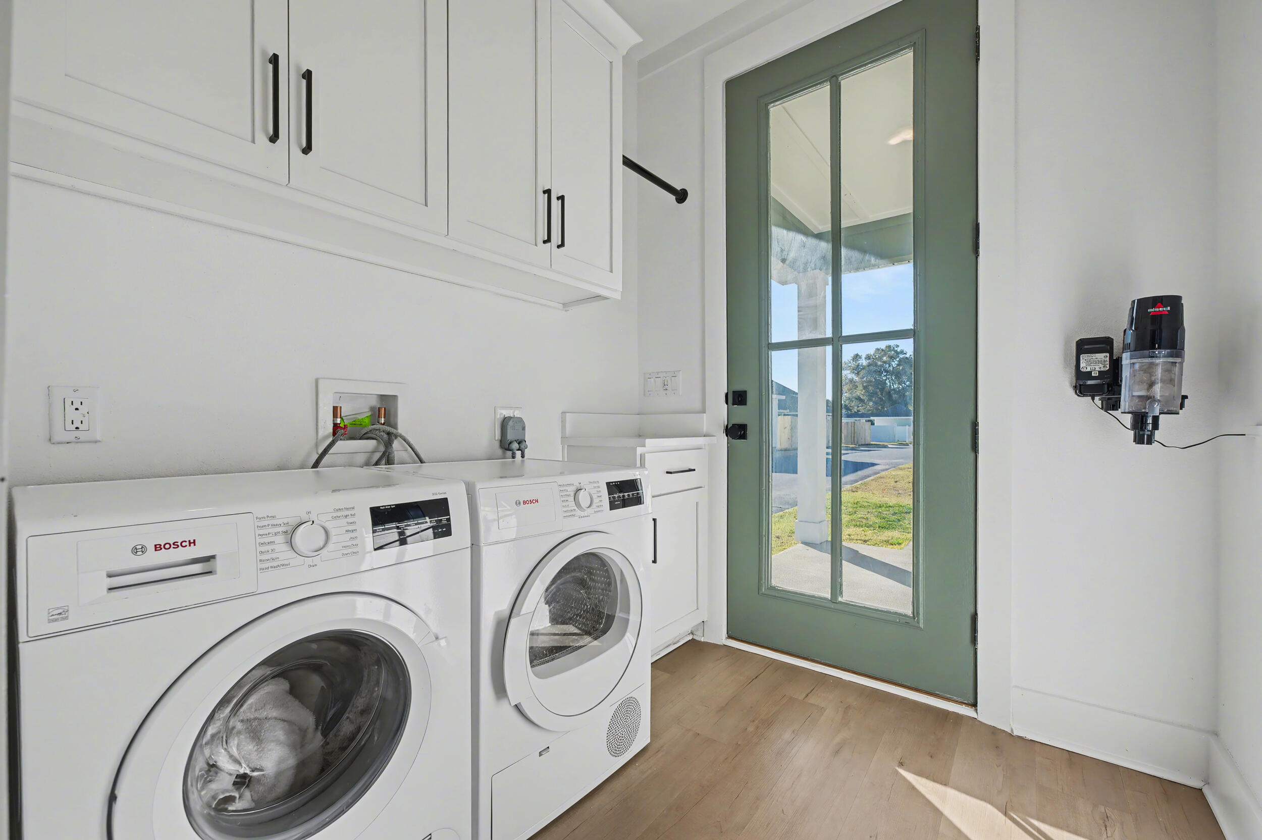 141 South H Street Pensacola, FL 32502 - Photo 27 of 30 a view of livingroom with washer and dryer