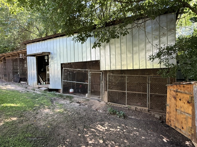 731 Glenn Ferry Road Fair Play, SC 29643 - Photo 20 of 23 A rustic barn structure provides ample space for storage or animal housing amidst a natural, wooded setting.