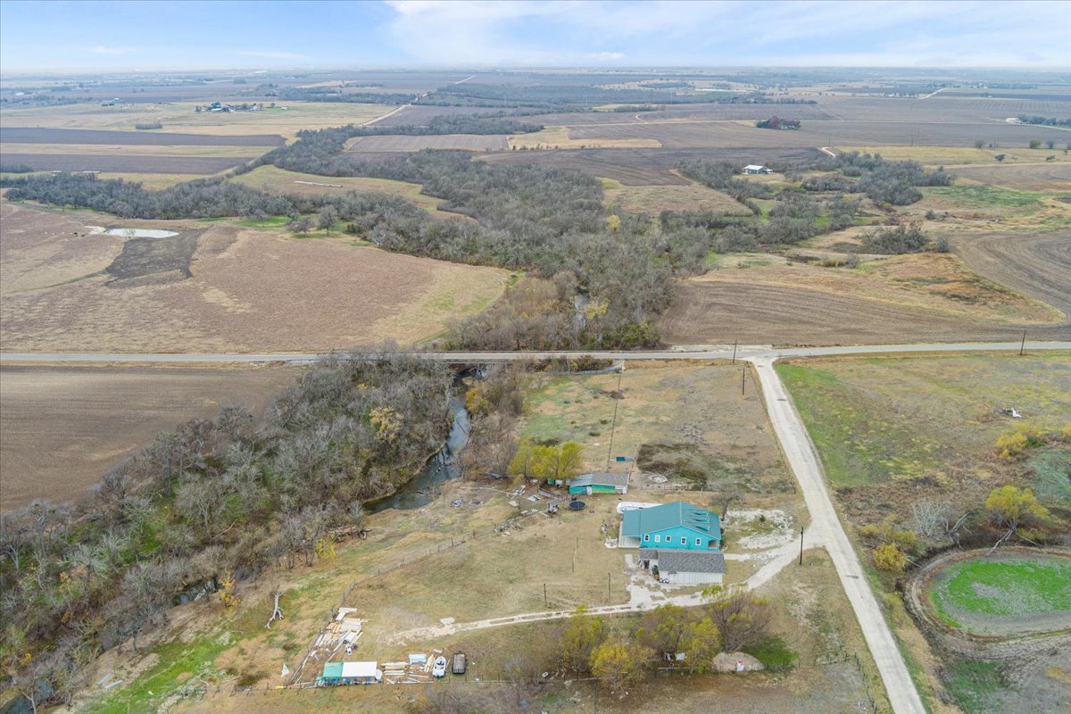 50 Dusty Dam Road Coupland, TX 78615 - Photo 30 of 38 Aerial views showcase the property’s expansive acreage and dual-residence layout.
