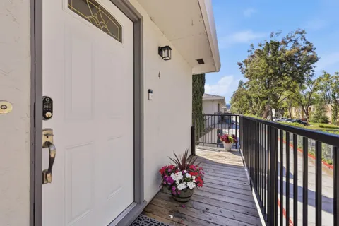 a balcony with wooden floor