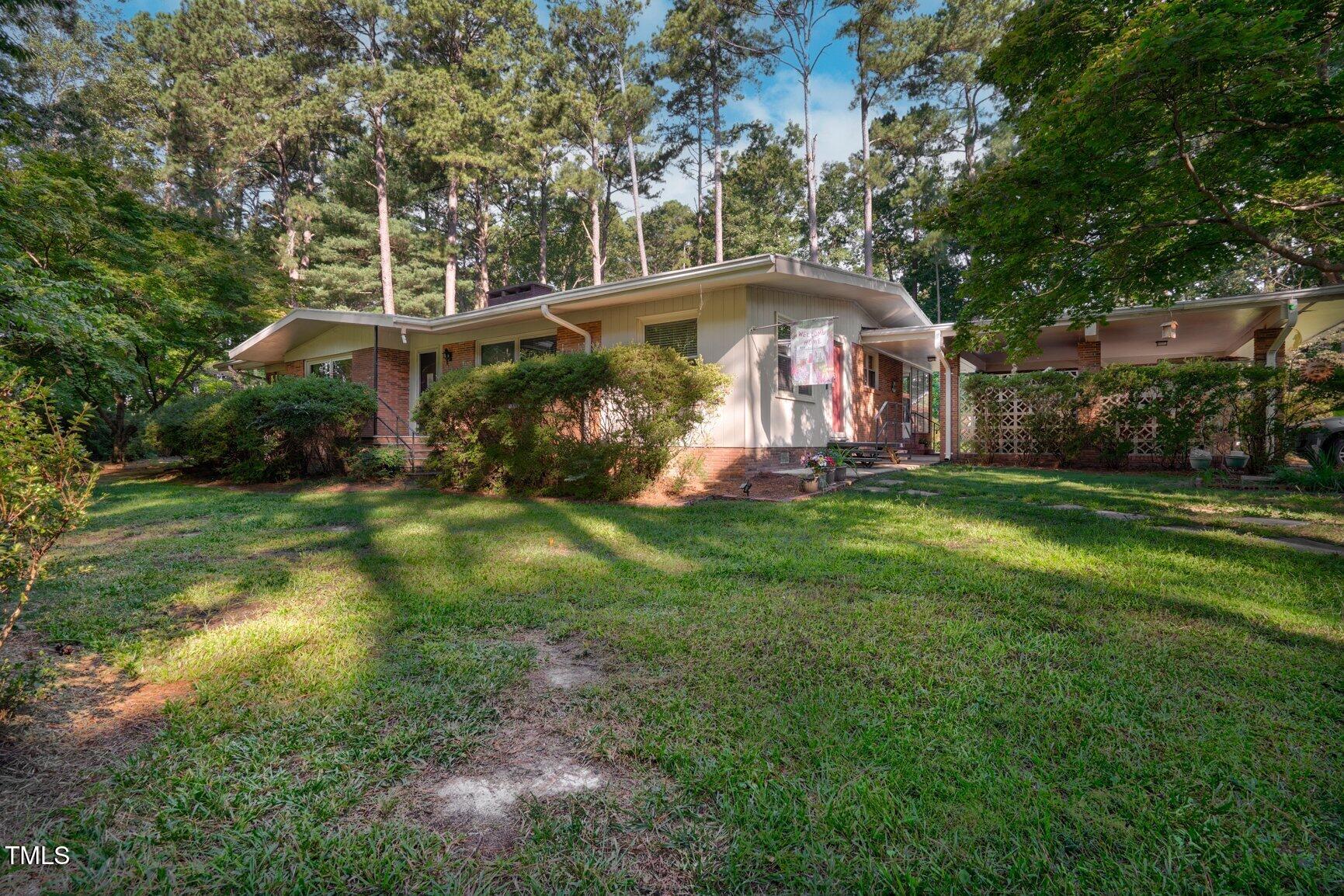 a view of a big yard next to a house